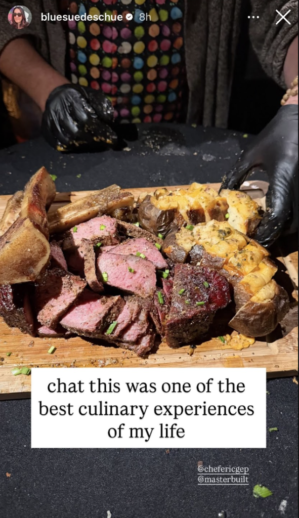 An Instagram Story from @bluesuedeschue captioned "chat this was one of the best culinary experiences of my life," showing a chef in black gloves carving a perfectly cooked ribeye with roasted potatoes on a wooden board, tagging @chefericgep and @masterbuilt.