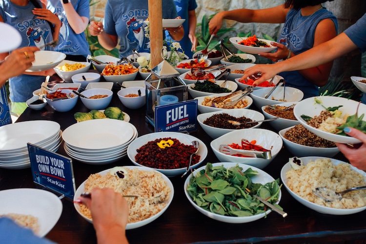 Journalist eating a meal with Starkist at CBC Health House