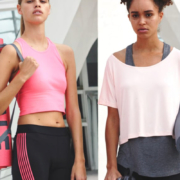 Two woman holding yoga mats and wearing workout clothes