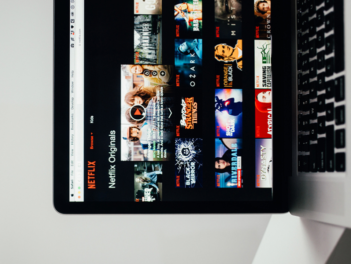 Computer displaying Netflix on scren