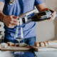 Man pouring wine using Coravin wine opener