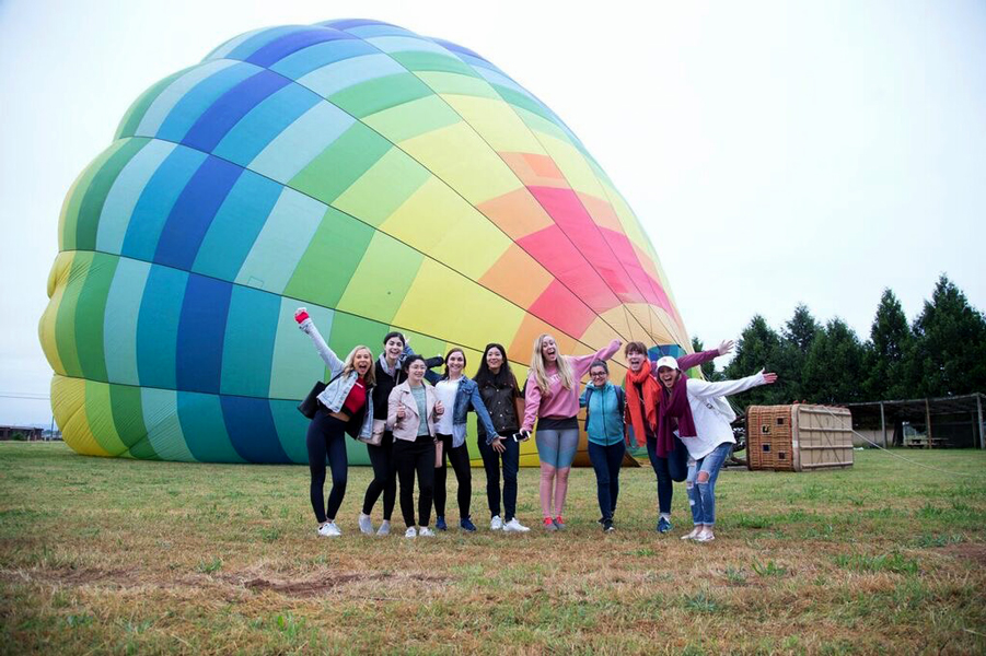 Influencers and editors standing in front of a hot air balloon at Culinary House