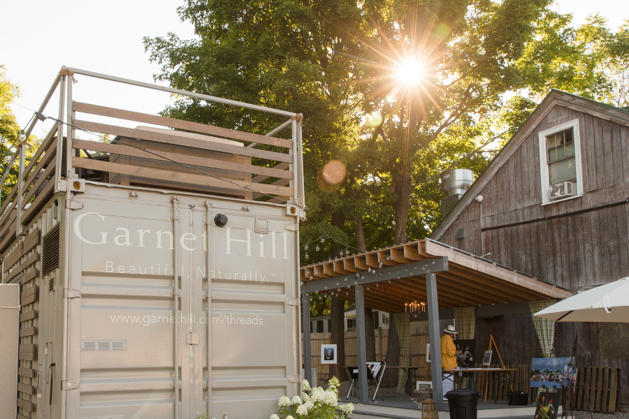 Garnet Hill Mobile Boutique outside of a wooden barn