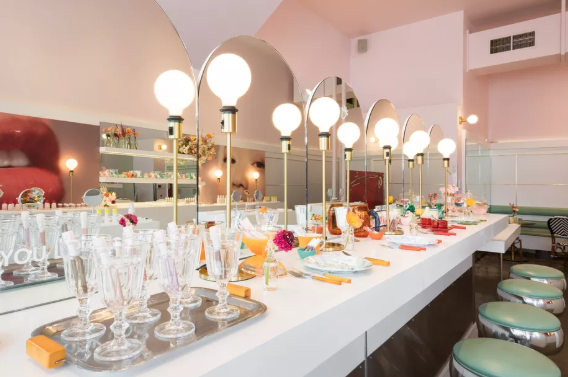 An experiential Glossier pop-up stpre partnership with Rhea's Cafe in San Francisco