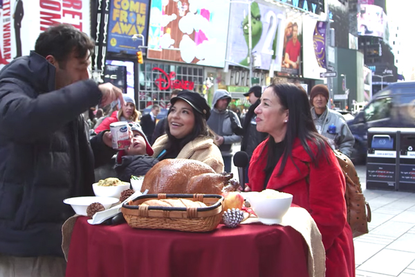 Two tourists being interviewed about Ocean Spray Cranberry Sauce for Thanksgiving in Times Square