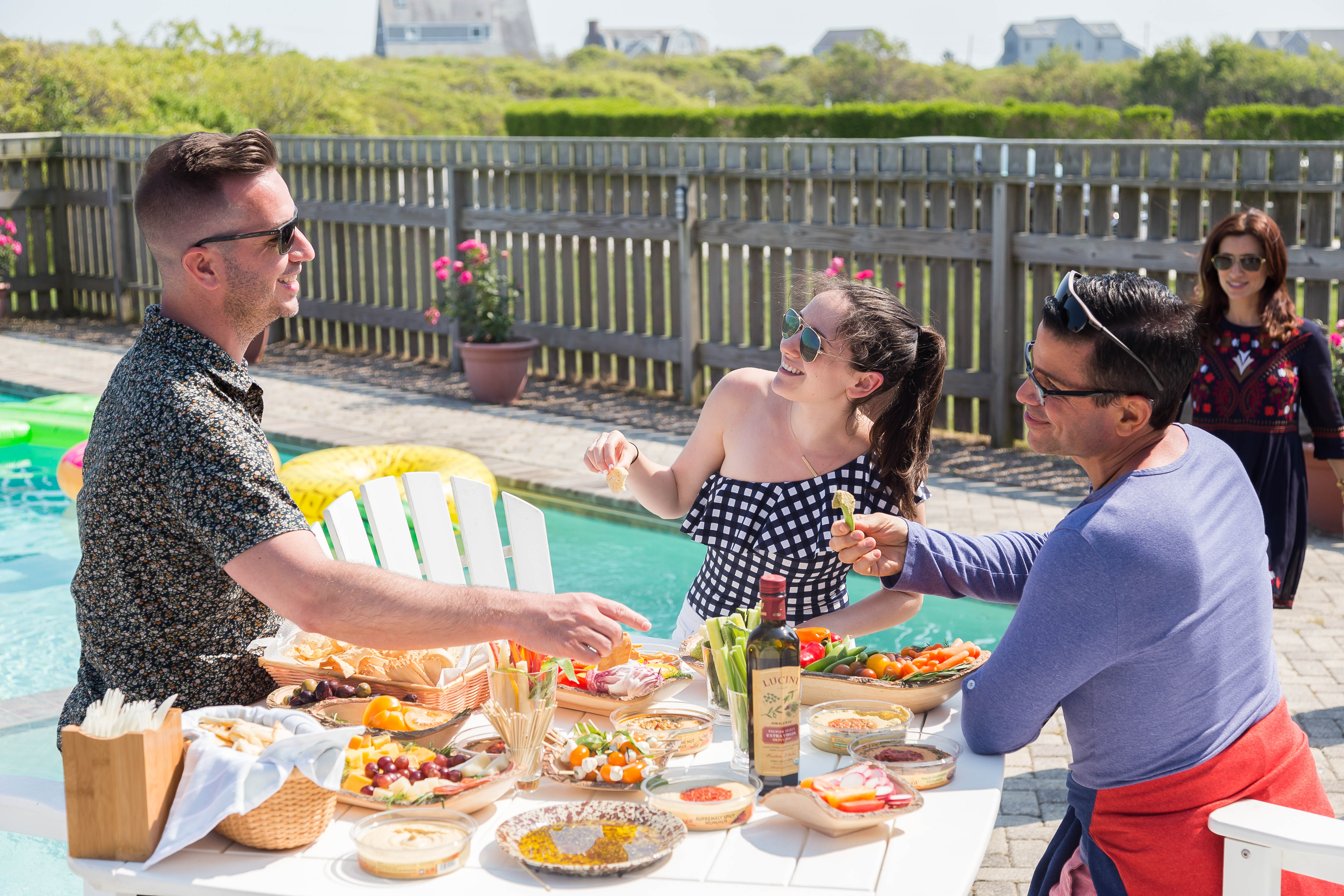 Sabra people snacking on hummus by the pool