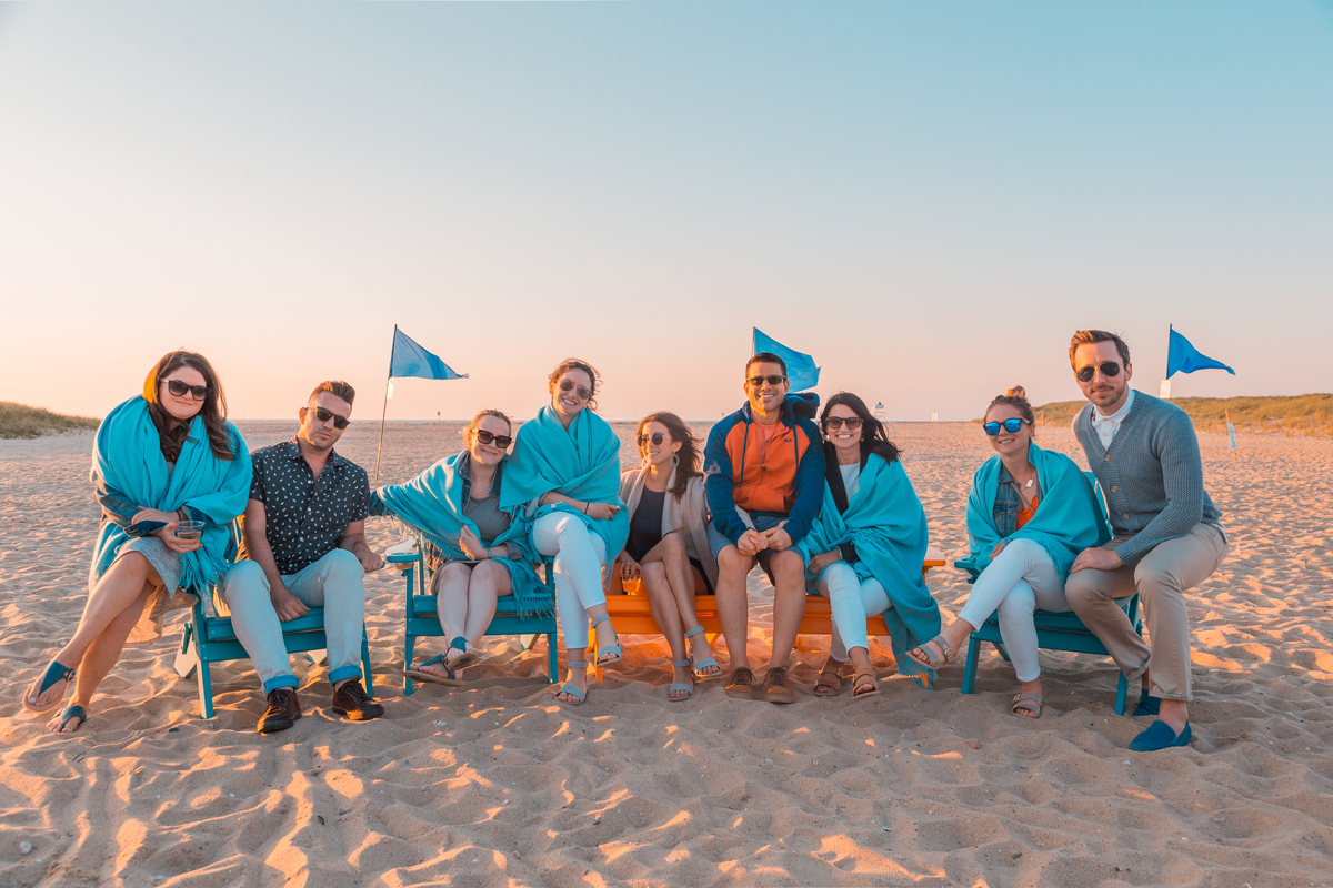 Group photo on the beach at sunset