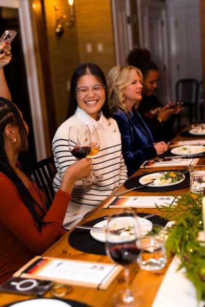Editor smiling candid at dinner during CBC's Holiday House 2025 press trip in Stowe, Vermont